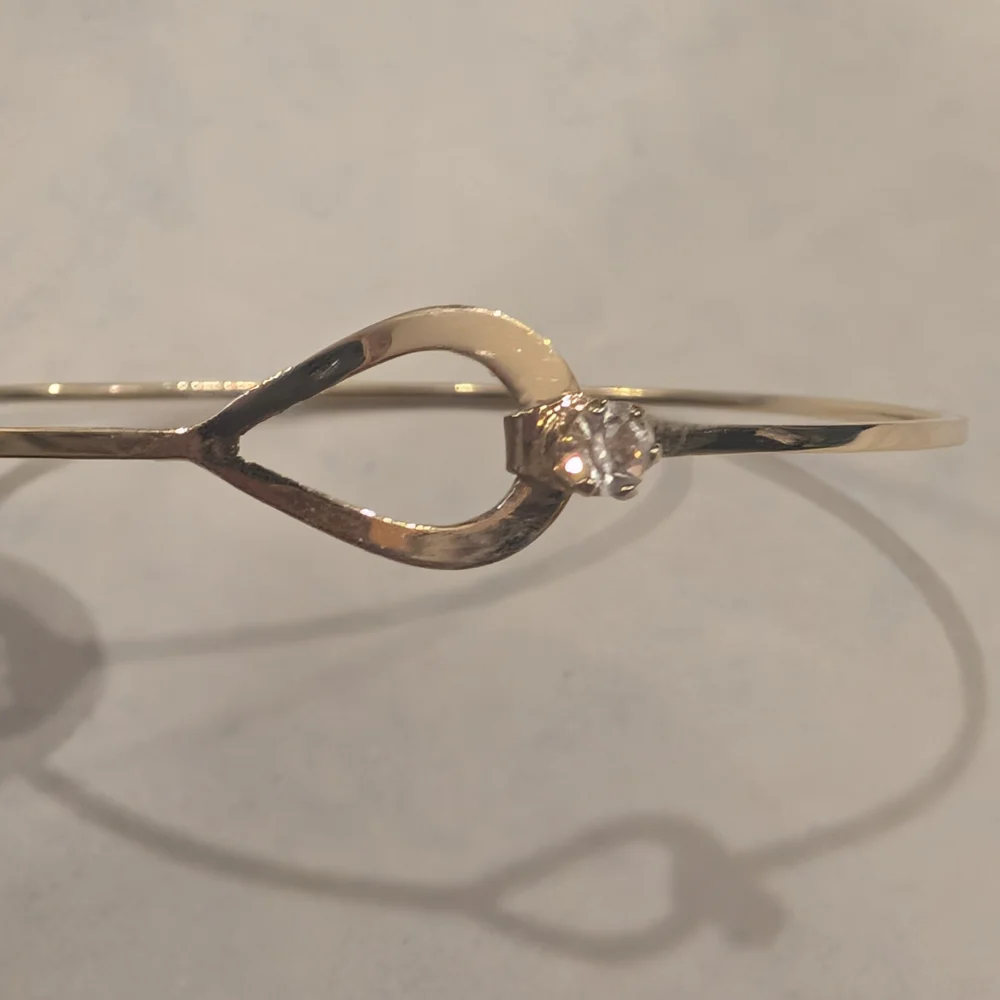 Avon Gold Tone Bypass Hinged Bracelet with Clear Stone - Picture 2 of 4